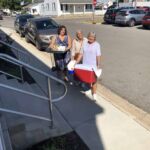 Marjorie Moor, Director of AgeSmart and Joy Paeth, past Director of AgeSmart help Marylou Dugan deliver meals.